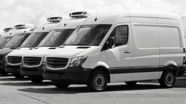 Fleet of vans on a UK road